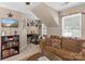 Cozy living room area in loft, perfect for relaxing and watching TV at 8211 Abbottsgate Ln, Charlotte, NC 28269