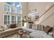 Bright living room features hardwood floors, natural light, and a view of the staircase at 8211 Abbottsgate Ln, Charlotte, NC 28269