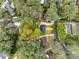 An aerial view showcases the neighborhood and property lines amid lush greenery and mature trees at 8525 Castlekeep Rd # 26, Charlotte, NC 28226