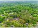 An aerial view showcases the neighborhood with lush greenery and mature trees providing plenty of shade at 8525 Castlekeep Rd # 26, Charlotte, NC 28226