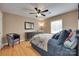 Comfortable bedroom with natural light, a ceiling fan, and hardwood flooring at 8525 Castlekeep Rd # 26, Charlotte, NC 28226