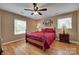 Comfortable bedroom with hardwood floors, natural light, and a spacious layout at 8525 Castlekeep Rd # 26, Charlotte, NC 28226