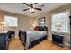 Bedroom featuring hardwood floors, a ceiling fan, and stylish decor at 8525 Castlekeep Rd # 26, Charlotte, NC 28226