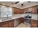 Well-lit kitchen featuring stainless steel appliances, shaker cabinets, and light countertops at 8525 Castlekeep Rd # 26, Charlotte, NC 28226