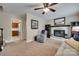 Warm living area features a fireplace, built-in bookshelves, and comfortable seating at 8525 Castlekeep Rd # 26, Charlotte, NC 28226