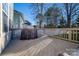 Large wooden deck with a grill, perfect for outdoor entertaining and relaxing in the backyard at 8532 Westmoreland Lake Dr, Cornelius, NC 28031
