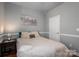 Comfortable bedroom with soft lighting, a cozy bed, and stylish decor, creating a restful atmosphere at 8532 Westmoreland Lake Dr, Cornelius, NC 28031