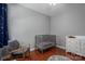 Charming Bedroom with a cozy crib, rocking chair, and dresser, creating a comforting space at 8532 Westmoreland Lake Dr, Cornelius, NC 28031