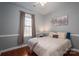 Well-lit bedroom featuring hardwood floors and neutral tones, offering a peaceful retreat at 8532 Westmoreland Lake Dr, Cornelius, NC 28031