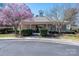 Community clubhouse with a well-manicured lawn and landscaping at 8532 Westmoreland Lake Dr, Cornelius, NC 28031