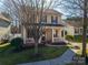 Charming two-story home featuring a welcoming front porch and meticulously maintained landscaping at 8532 Westmoreland Lake Dr, Cornelius, NC 28031