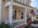 Inviting front porch featuring classic rocking chairs, perfect for enjoying the outdoors at 8532 Westmoreland Lake Dr, Cornelius, NC 28031