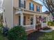 Inviting front porch featuring classic rocking chairs, perfect for enjoying the outdoors at 8532 Westmoreland Lake Dr, Cornelius, NC 28031