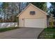 A detached garage with a basketball hoop on the exterior at 8532 Westmoreland Lake Dr, Cornelius, NC 28031