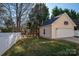 Detached garage with a basketball hoop, offering ample storage and recreational possibilities at 8532 Westmoreland Lake Dr, Cornelius, NC 28031