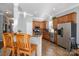 Spacious kitchen features stainless steel appliances, wood cabinets and tile flooring at 8532 Westmoreland Lake Dr, Cornelius, NC 28031