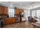 Spacious kitchen with stainless steel appliances, wood cabinets, and an adjacent dining area, perfect for entertaining at 8532 Westmoreland Lake Dr, Cornelius, NC 28031