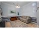 Comfortable living room with a plush sofa, neutral tones, and a decorative rug, creating a relaxing atmosphere at 8532 Westmoreland Lake Dr, Cornelius, NC 28031