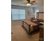 This warm bedroom has a large window and ceiling fan at 9340 Grand Valley Dr, Charlotte, NC 28213