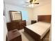 Well-lit bedroom with nice wooden furniture and large mirror at 9340 Grand Valley Dr, Charlotte, NC 28213