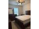 A furnished bedroom with a queen bed and a ceiling fan at 9340 Grand Valley Dr, Charlotte, NC 28213