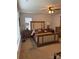 A well-lit bedroom with warm wooden furniture and neutral walls at 9340 Grand Valley Dr, Charlotte, NC 28213