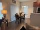 A cozy dining area features modern chairs and a decorative chandelier at 9340 Grand Valley Dr, Charlotte, NC 28213