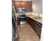 A kitchen featuring granite countertops, stainless steel appliances, and wood cabinets at 9340 Grand Valley Dr, Charlotte, NC 28213