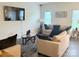 Inviting living room with a large television, modern decor and plush seating for Gathering enjoyment at 9340 Grand Valley Dr, Charlotte, NC 28213