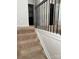 Upstairs staircase with plush carpeting and a decorative railing leading to the upper level of the home at 9340 Grand Valley Dr, Charlotte, NC 28213
