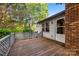 Spacious wooden deck with wood and brick accents at 9640 Heartwood Ln, Mint Hill, NC 28227