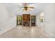Cozy living room featuring a brick fireplace, hardwood floors, and natural light at 9640 Heartwood Ln, Mint Hill, NC 28227