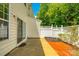 Private patio with mature trees and flowering shrubs at 975 Copperstone Ln, Fort Mill, SC 29708