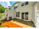 Private patio with mature trees and view of slider door and back door at 975 Copperstone Ln, Fort Mill, SC 29708
