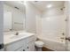 Bathroom featuring a single sink vanity and shower-tub combo with white fixtures at 975 Copperstone Ln, Fort Mill, SC 29708
