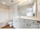 Clean bathroom featuring a vanity, a large mirror, and a shower-tub combo at 975 Copperstone Ln, Fort Mill, SC 29708