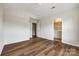 Bedroom featuring hardwood floors and access to a private bathroom at 975 Copperstone Ln, Fort Mill, SC 29708
