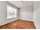 Bright bedroom featuring hardwood floors and large window for natural light at 975 Copperstone Ln, Fort Mill, SC 29708