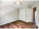 Bright bedroom features hardwood floors, neutral paint, closet, and ceiling fan at 975 Copperstone Ln, Fort Mill, SC 29708