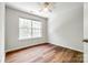 Bedroom featuring a large window bringing in natural light, and hardwood floors at 975 Copperstone Ln, Fort Mill, SC 29708