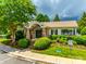 Community clubhouse featuring stone accents, lush landscaping, and pool at 975 Copperstone Ln, Fort Mill, SC 29708
