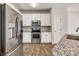 Kitchen features stainless steel appliances, granite countertops, and white cabinets at 975 Copperstone Ln, Fort Mill, SC 29708