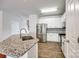 Open kitchen features stainless steel appliances, granite countertops, and center island at 975 Copperstone Ln, Fort Mill, SC 29708