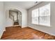 Bright room featuring hardwood floors, staircase, and large window for natural light at 975 Copperstone Ln, Fort Mill, SC 29708