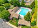 Aerial view of community pool, clubhouse, parking, and lush landscaping at 975 Copperstone Ln, Fort Mill, SC 29708
