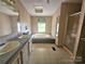 This bathroom features a bathtub, shower, and dual sink vanity at 1001 Bexley Ln, Lincolnton, NC 28092