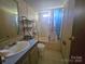 Cozy bathroom featuring a single sink, toilet, and shower/tub combo at 1001 Bexley Ln, Lincolnton, NC 28092