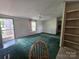 Living room with carpet, light fixtures, and a front door at 1001 Bexley Ln, Lincolnton, NC 28092