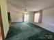 Living room with carpet, light fixtures, and a front door at 1001 Bexley Ln, Lincolnton, NC 28092