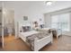 Bright bedroom with twin beds, colorful bedding, and adjacent bathroom at 10205 Alouette Dr, Waxhaw, NC 28173